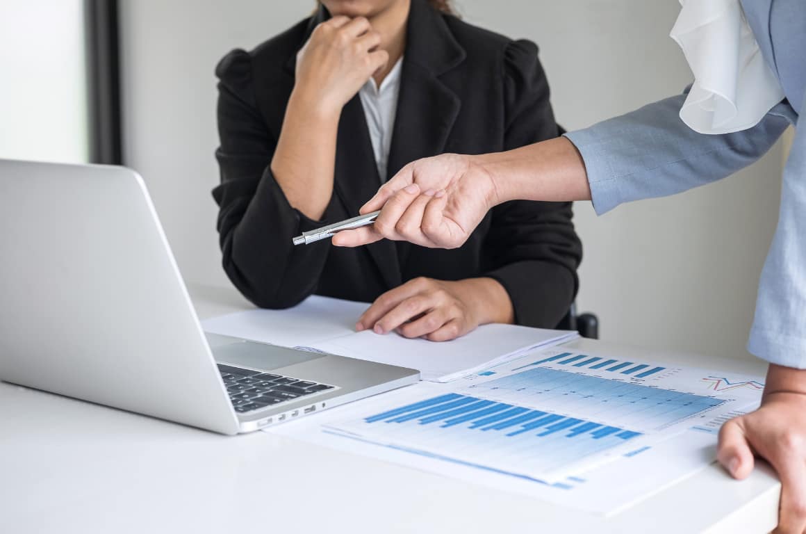Boss Teaching Employee About Presentation