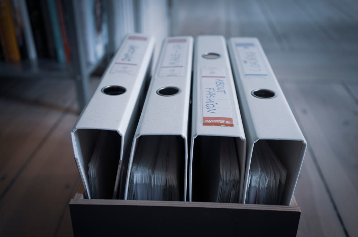 Collection of ring binders in box at home